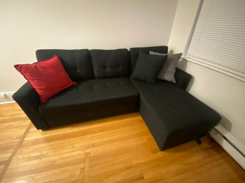 Black sectional sofa with pull-out bed