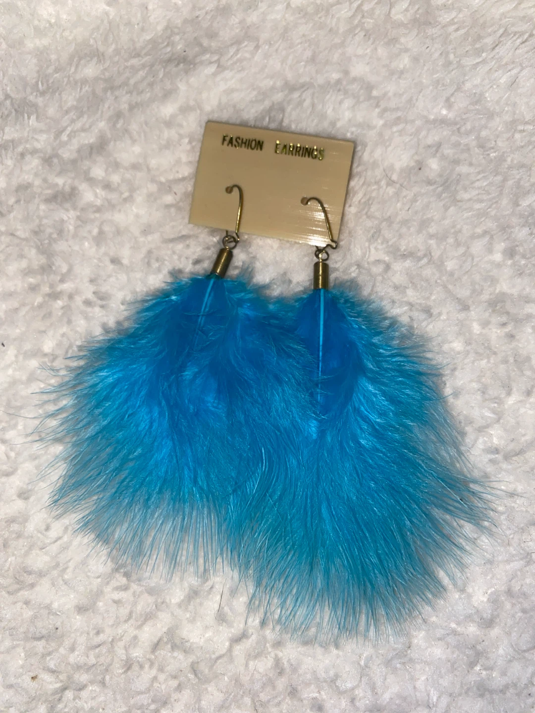 Bright blue feather earrings