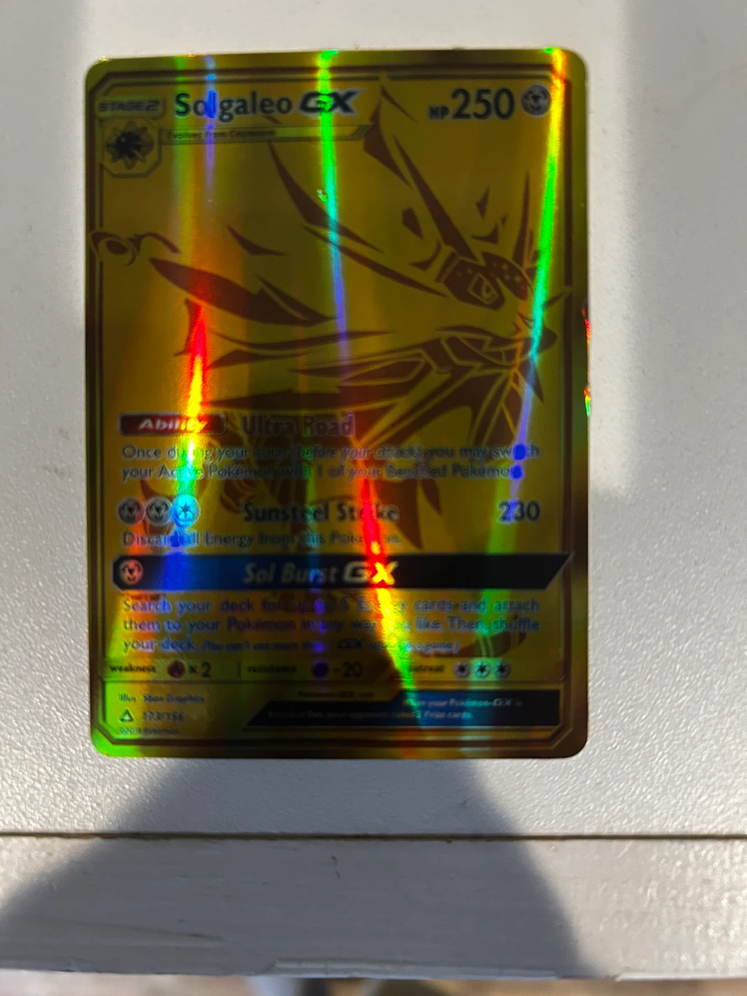Charizard and Solgaleo GX Pokemon cards