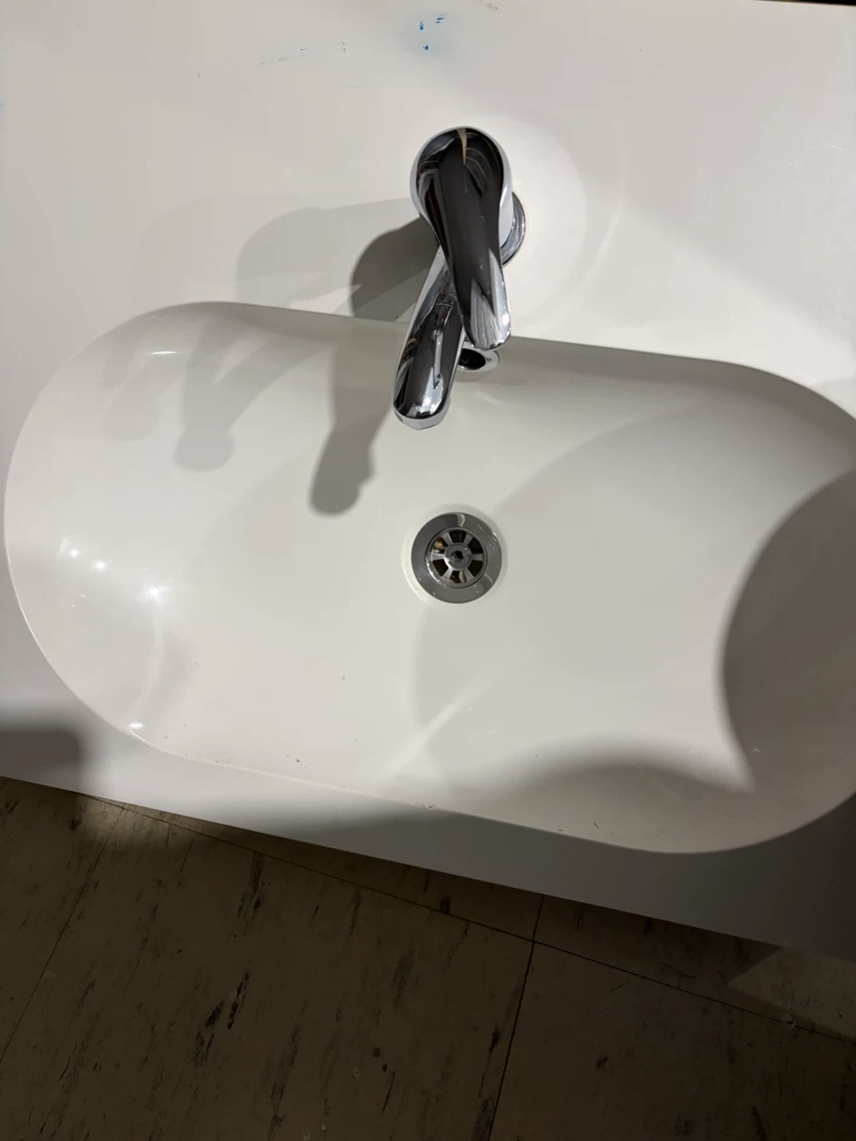 Bathroom sink with chrome faucet