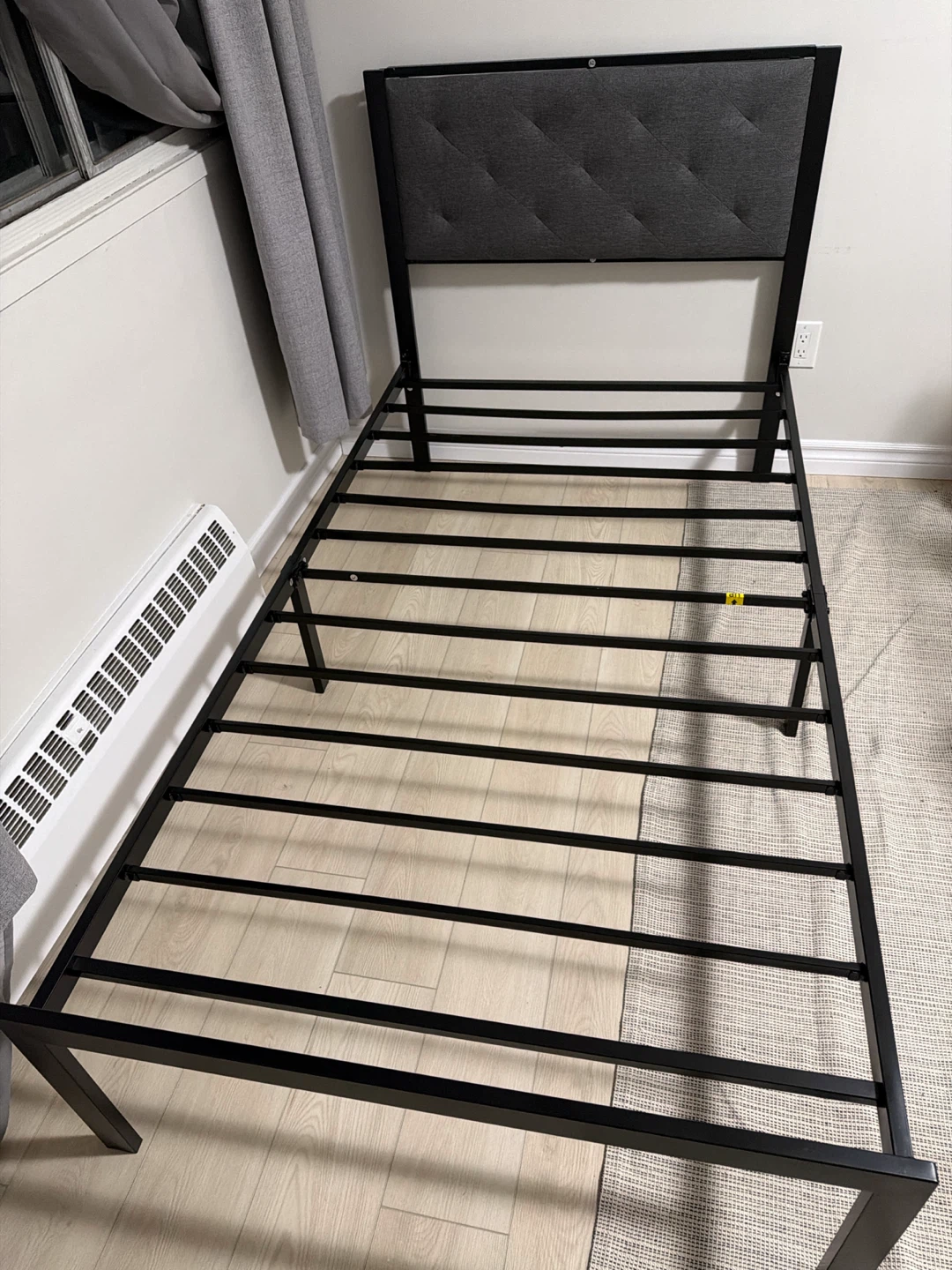 Twin size metal bed frame with upholstered headboard