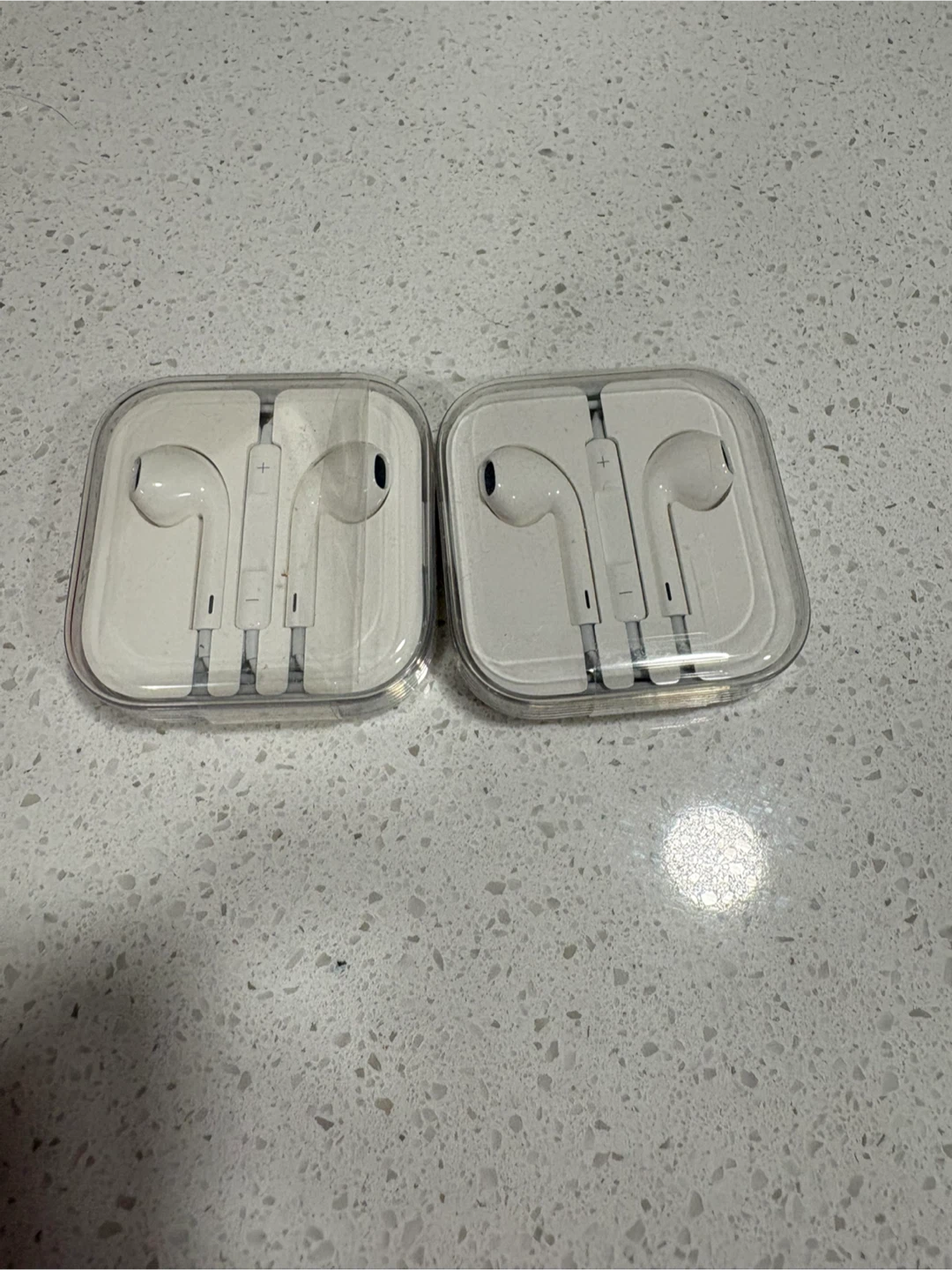 Two Apple EarPods with 3.5mm Headphone Plug