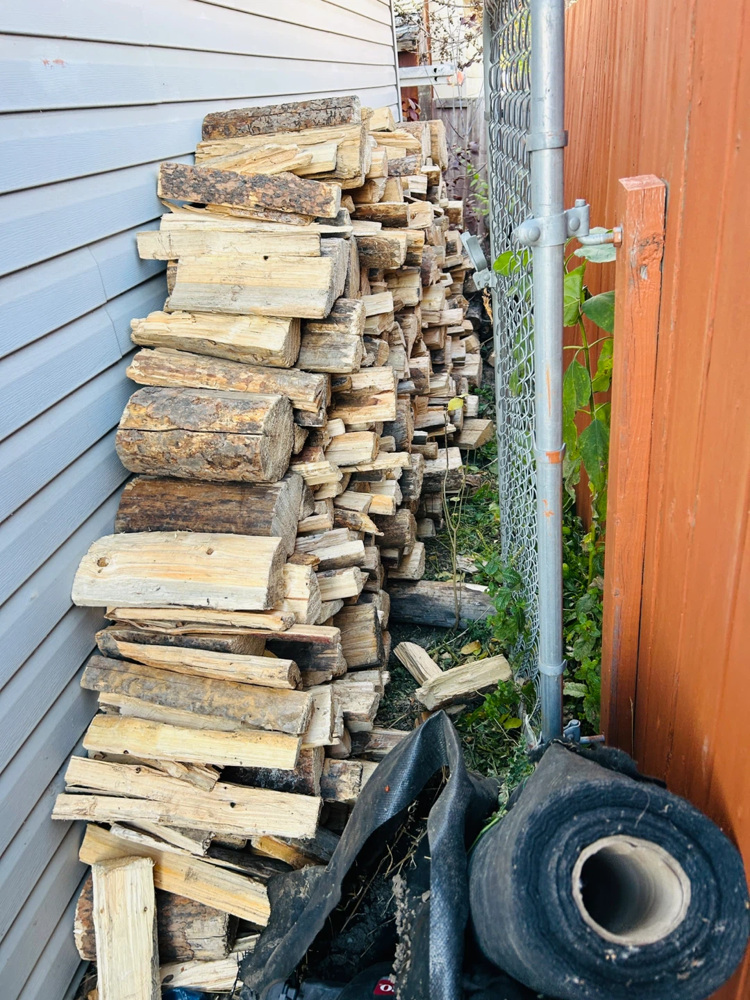Seasoned firewood pile - photo 3