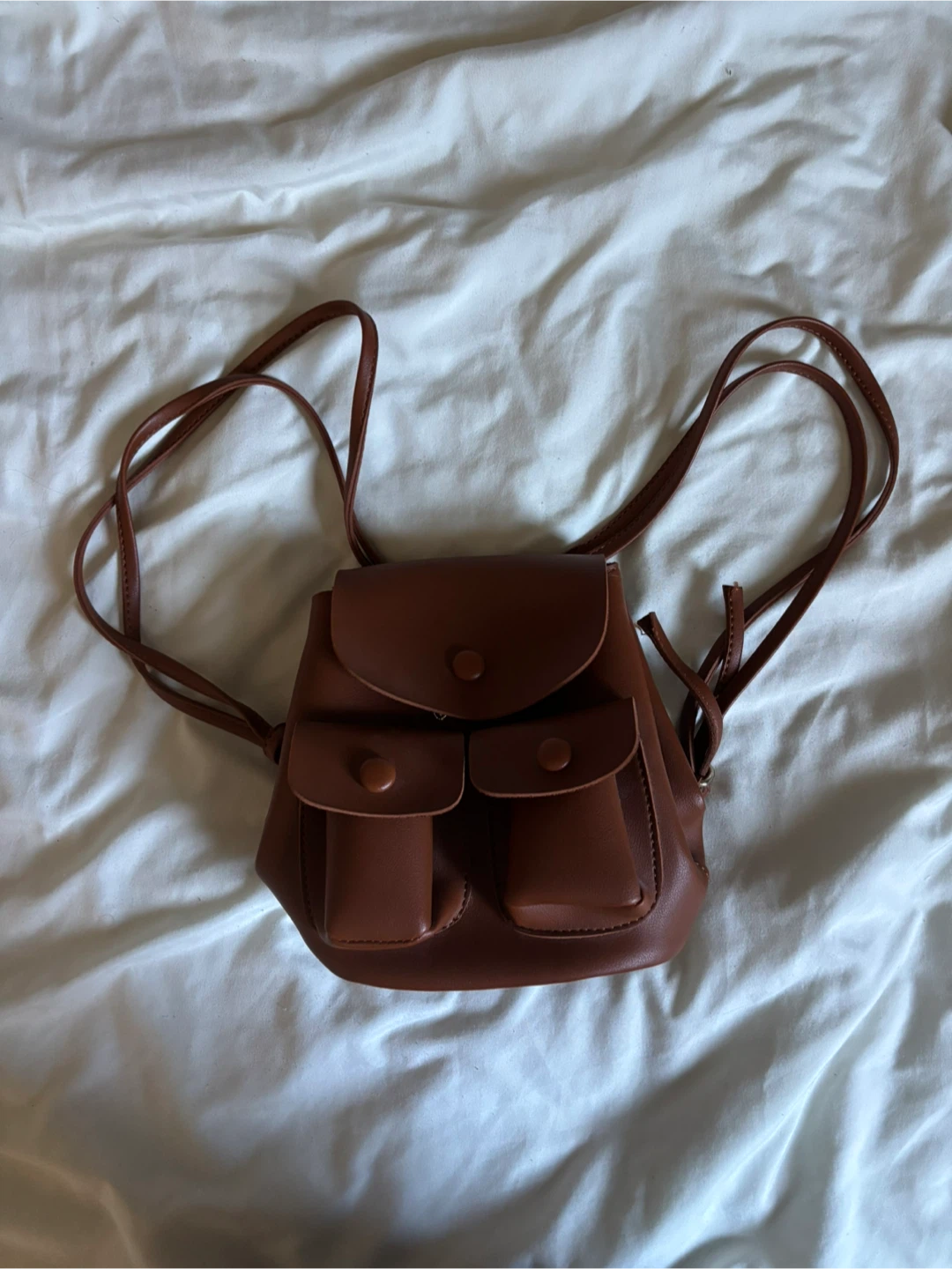 Small brown faux leather mini backpack