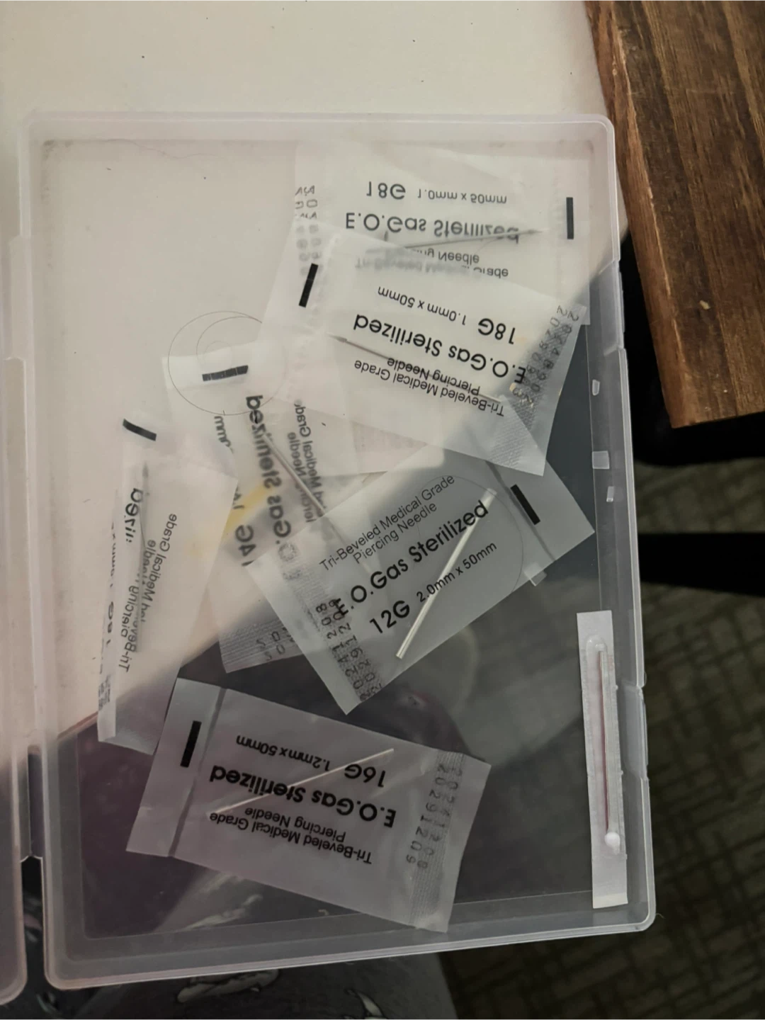 Disposable body piercing needles