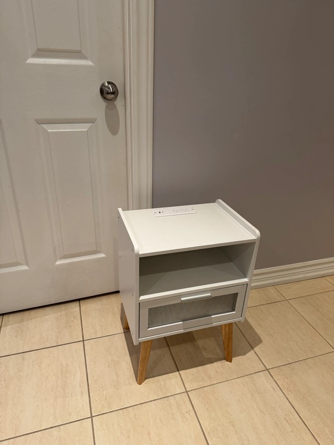 White bedside table with charging station