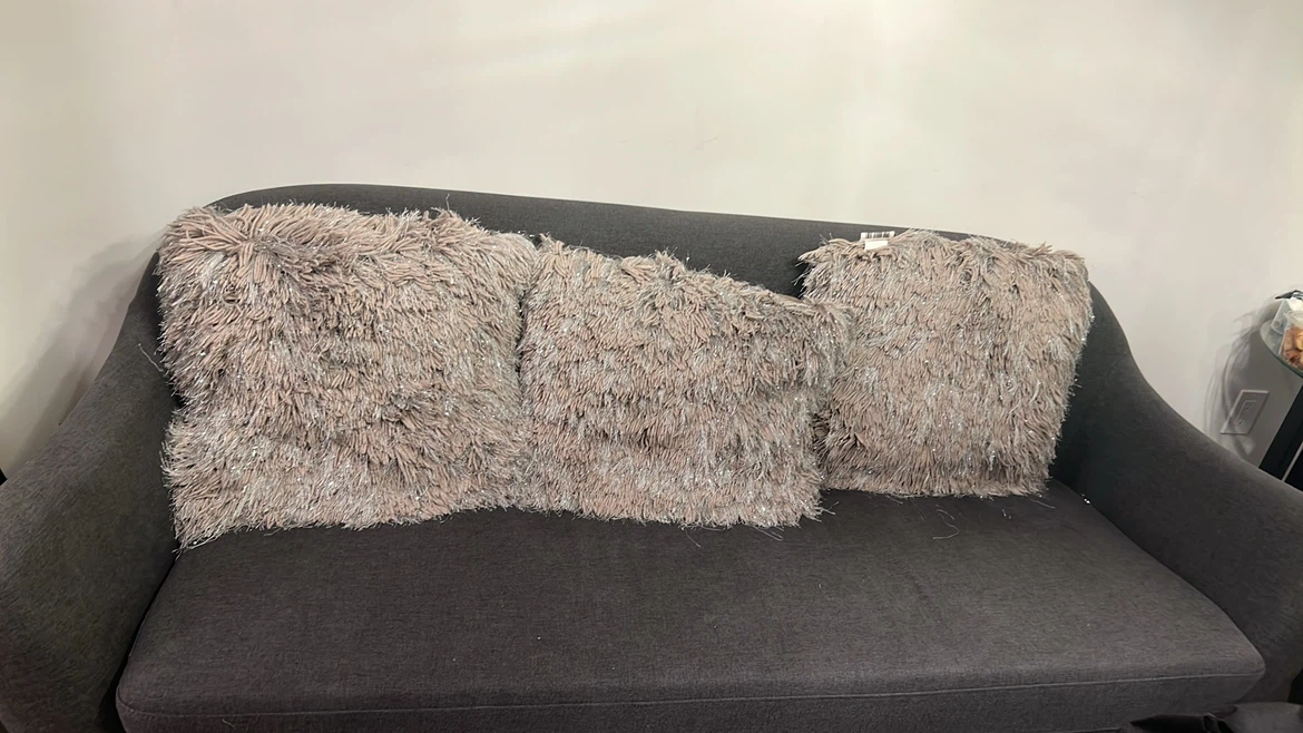 Dark Grey Sofa with Shaggy Pillows