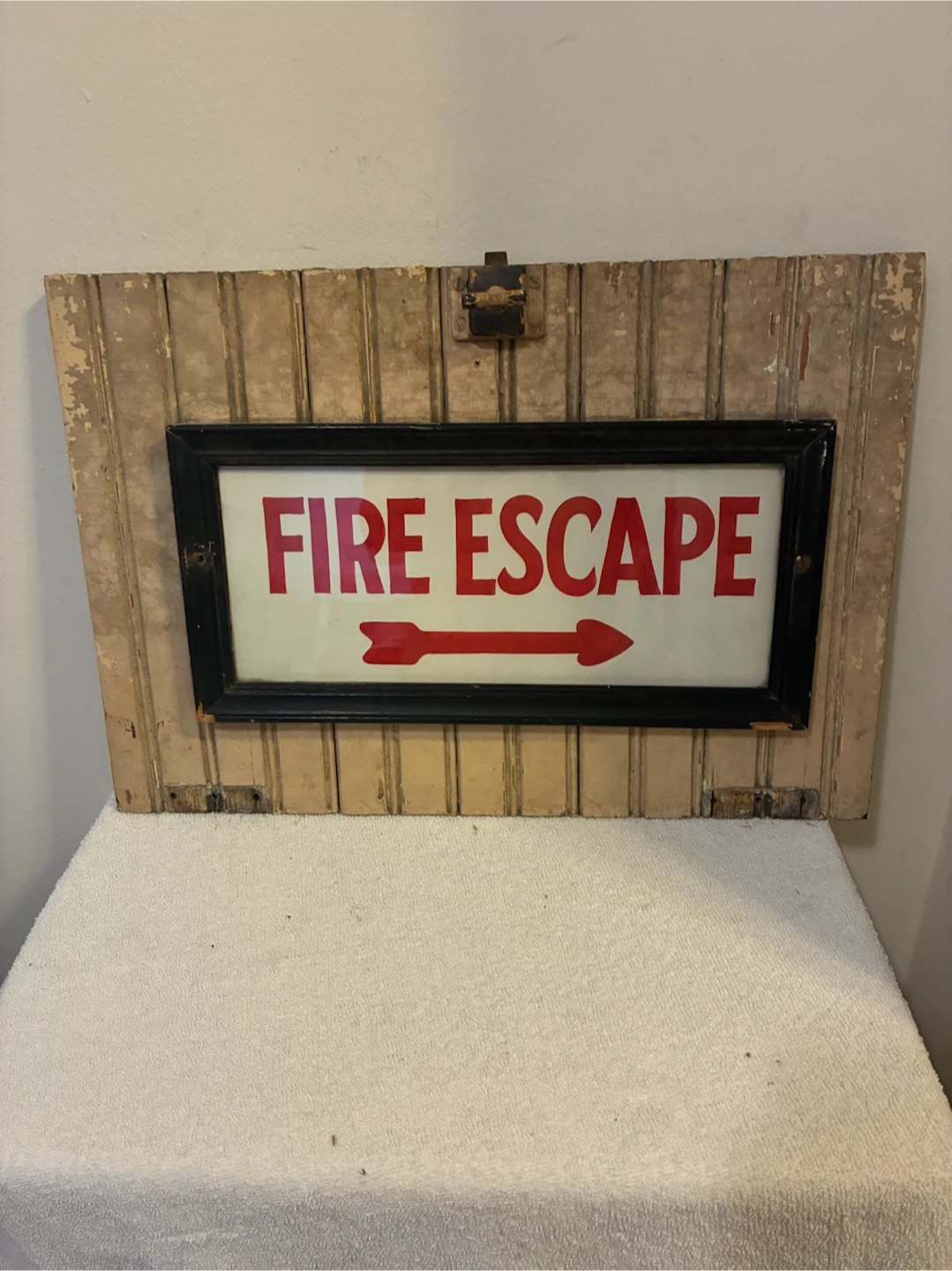 Vintage Fire Escape Sign on Wood Shutter