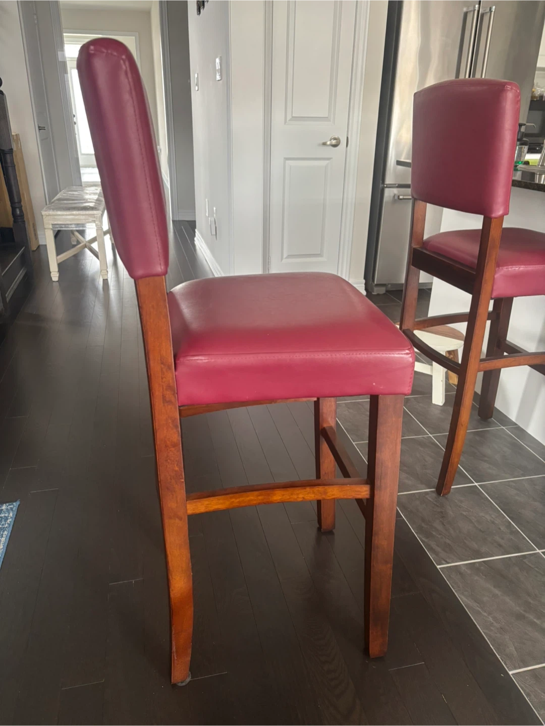 Two Burgundy Leather Bar Stools