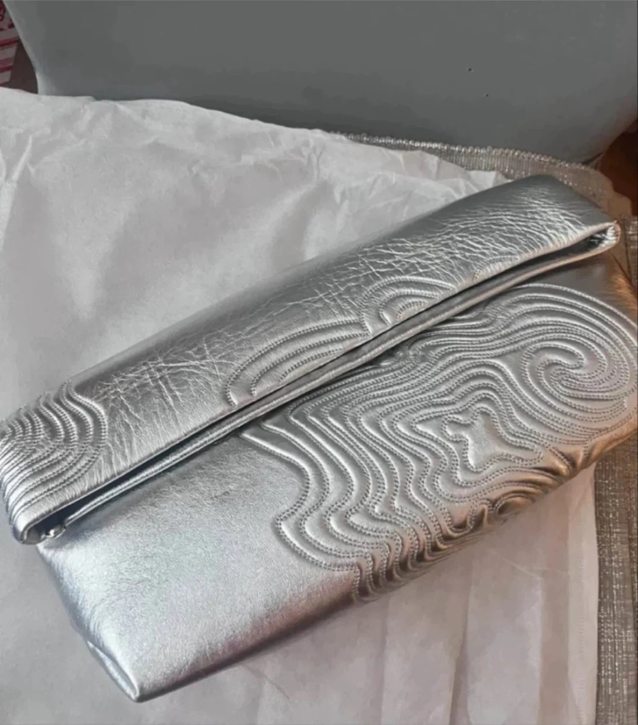 Silver textured clutch bag