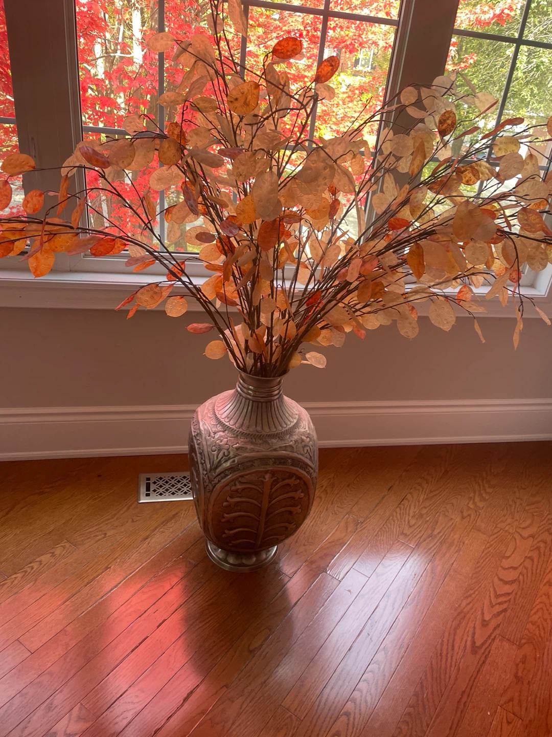 Large decorative metal floor vase with autumn branches