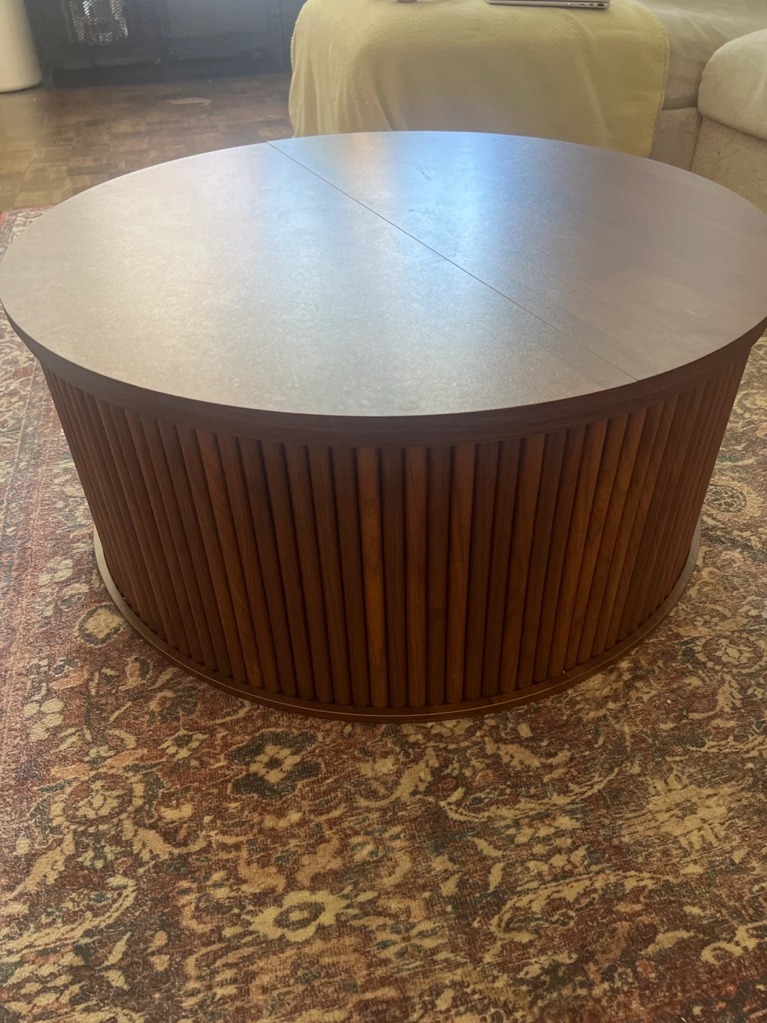 Round walnut particle board coffee table