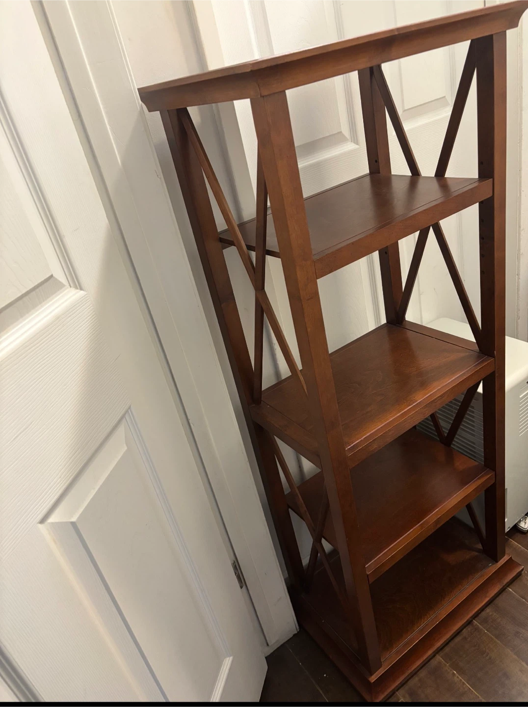 Wooden bookshelf with X-side frame