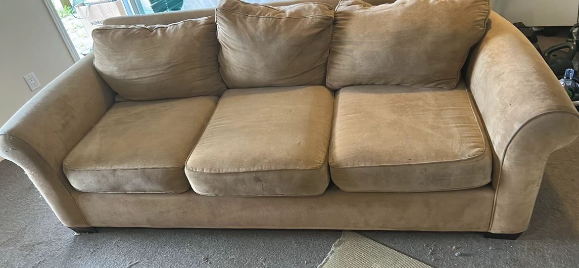 Three-seater beige fabric sofa