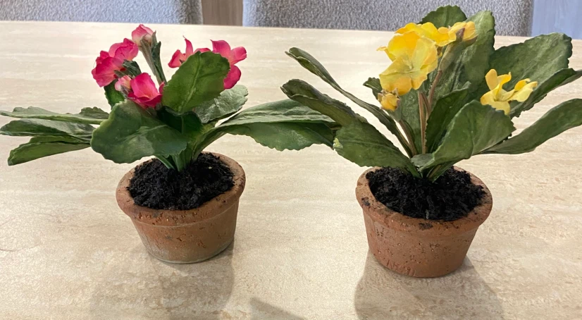 Two artificial potted flowers
