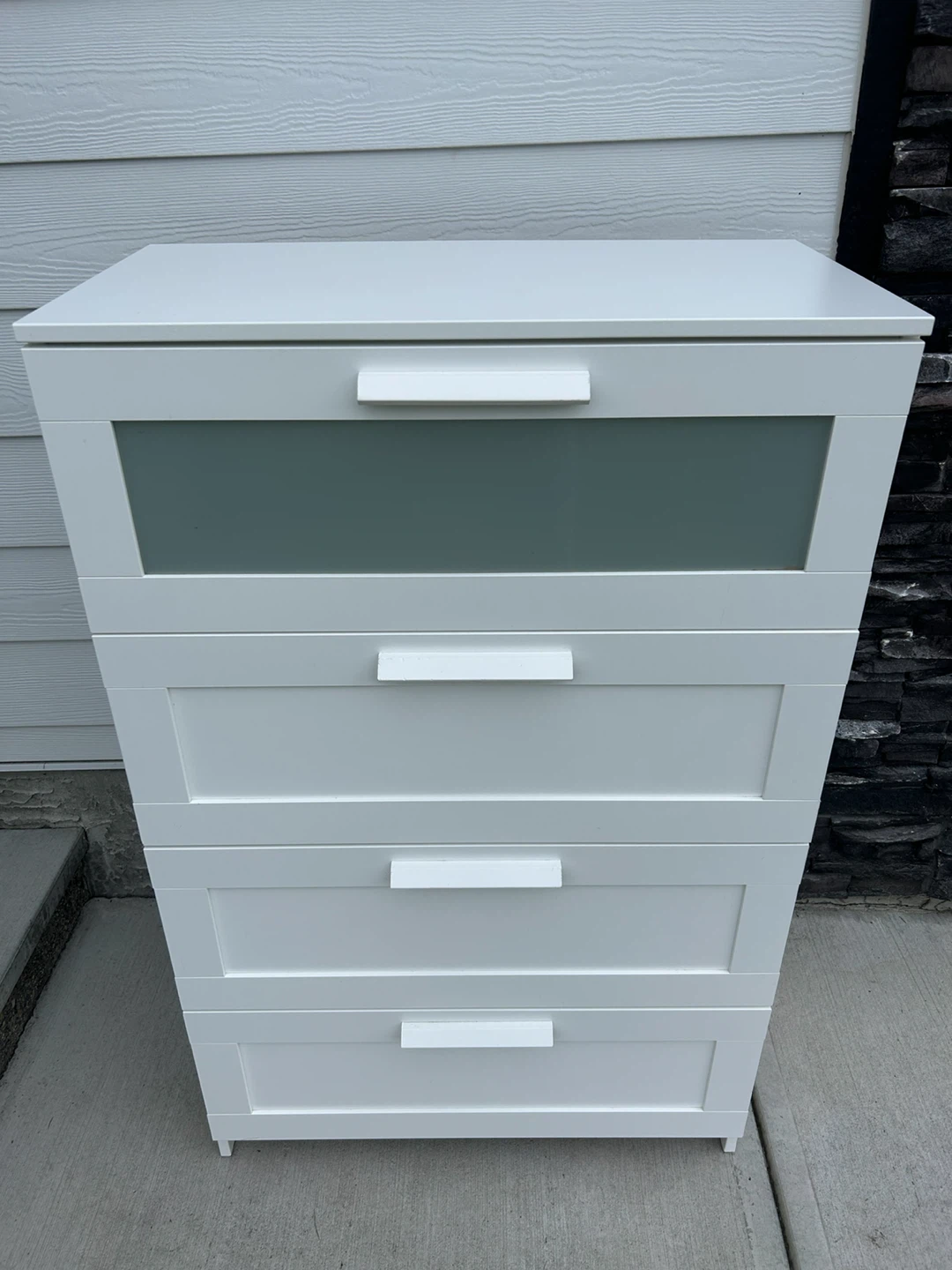 IKEA white dresser with a glass front
