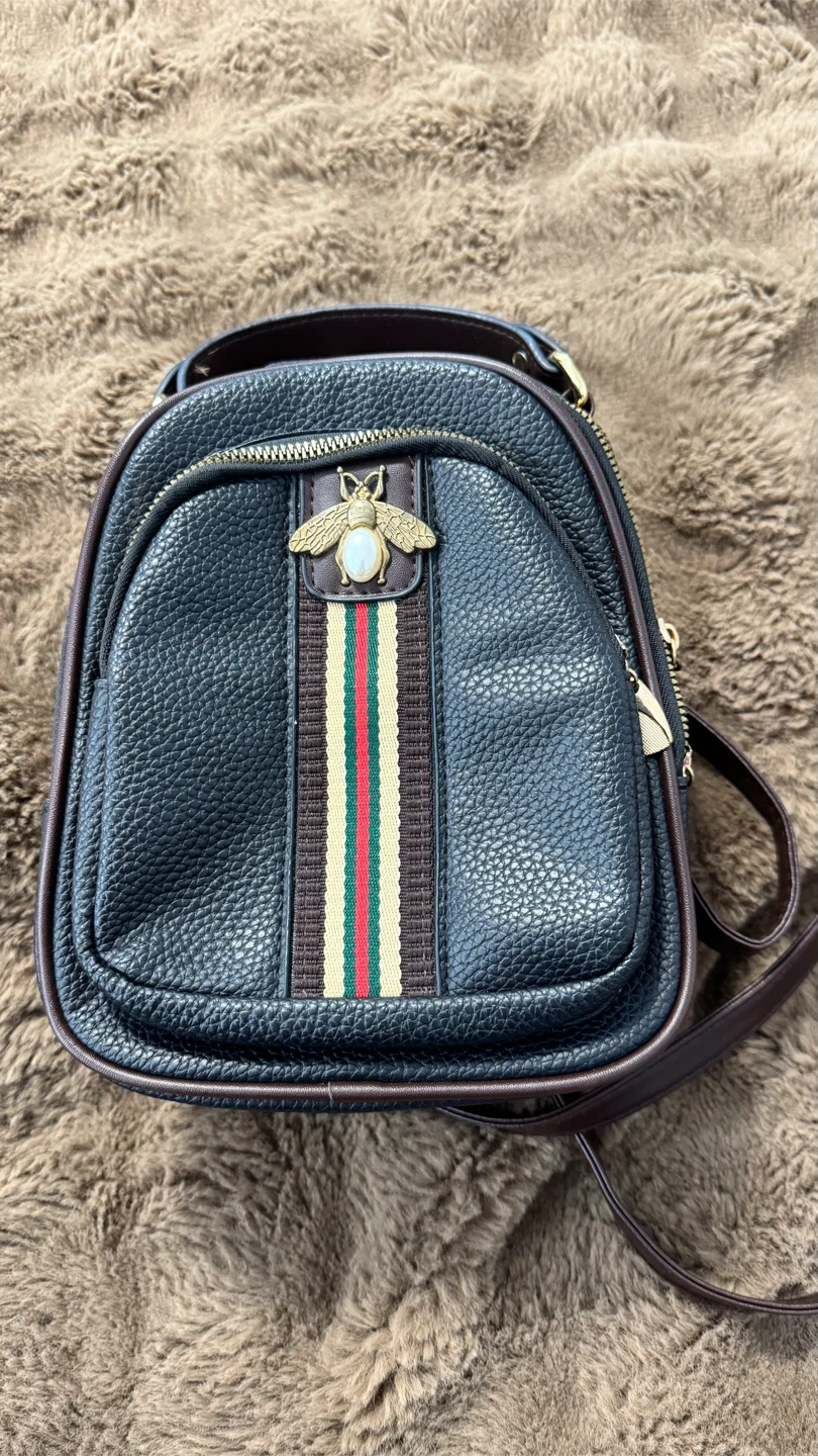 Small black and brown backpack purse