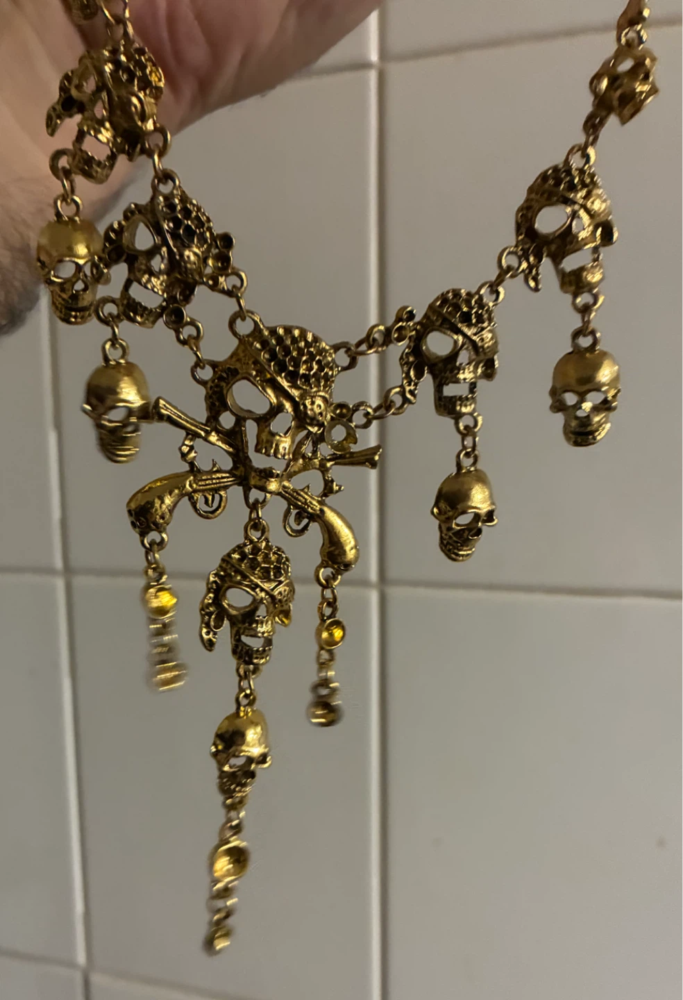 Gold-tone skull and pistol statement necklace - photo 2