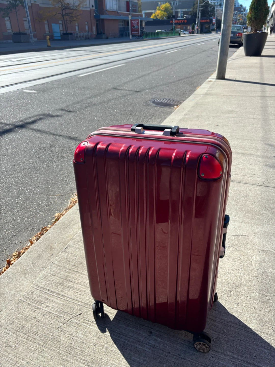 Large Check In Red hardshell suitcase with wheels