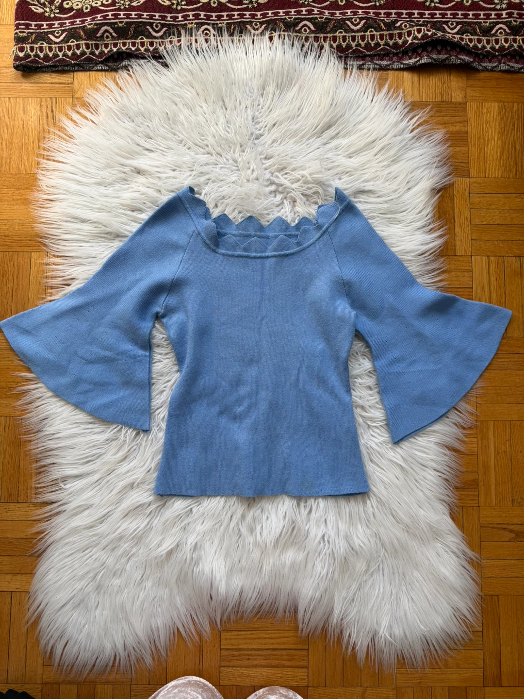 Light blue scalloped knit top