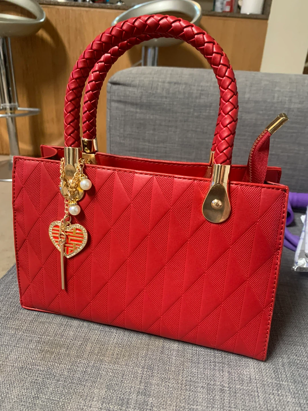 Red Textured Handbag with Heart Charm