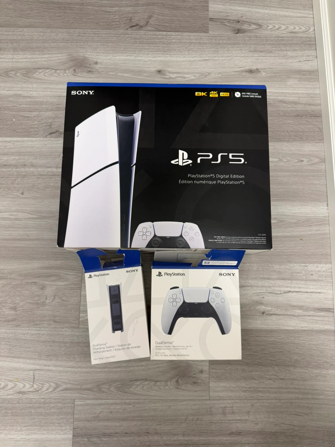 PS5 with an extra controller and charging station