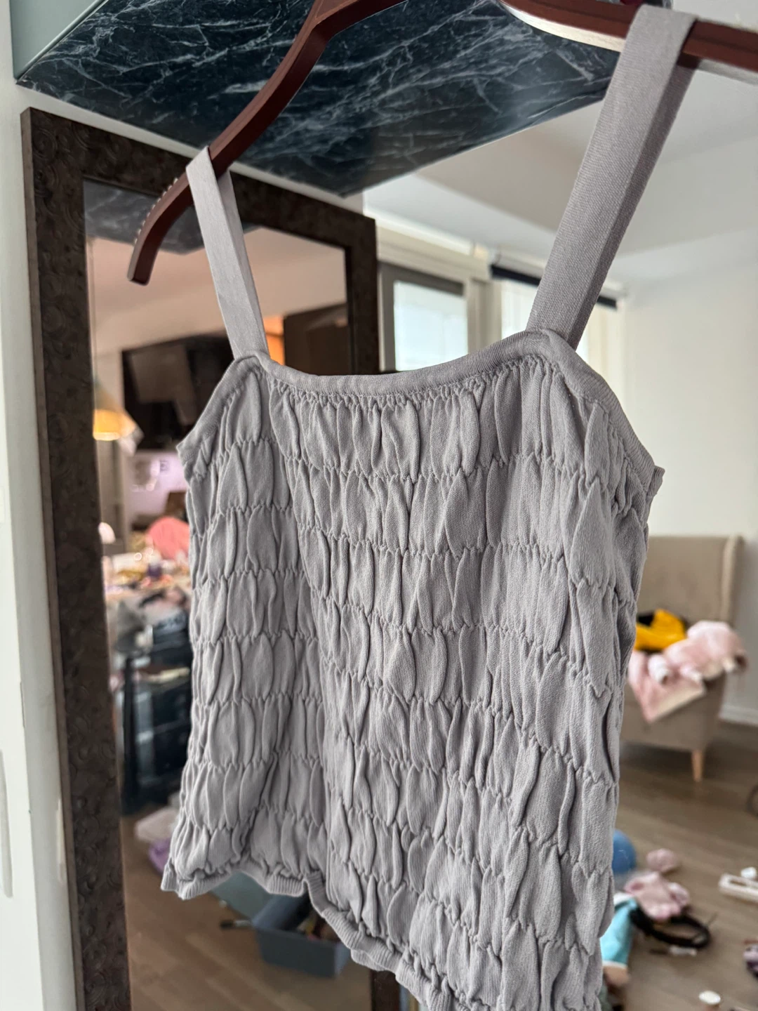 New: designer’s smocked blue top