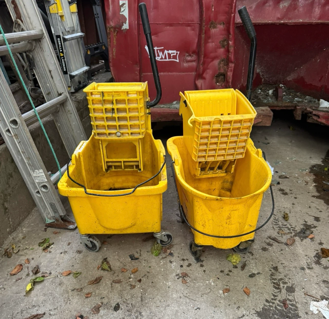 Two Yellow Janitorial Mop Buckets