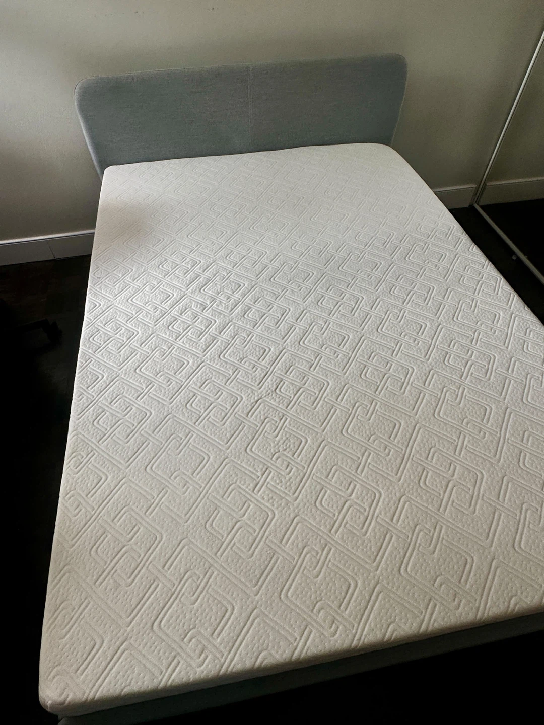 Double size mattress with grey upholstered bed frame. - photo 3