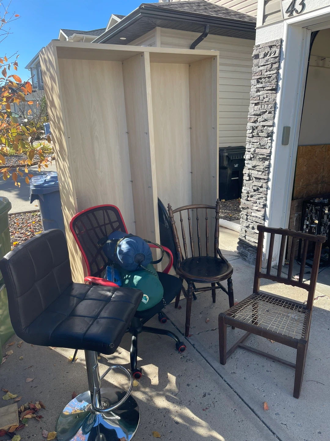 Light Wood Veneer Bookshelf and chairs