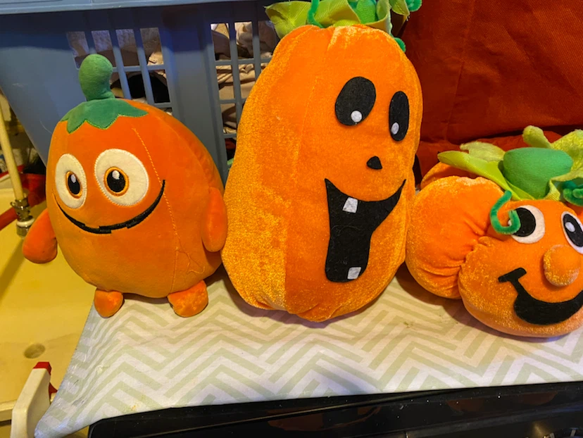 Set of three pumpkin plush toys