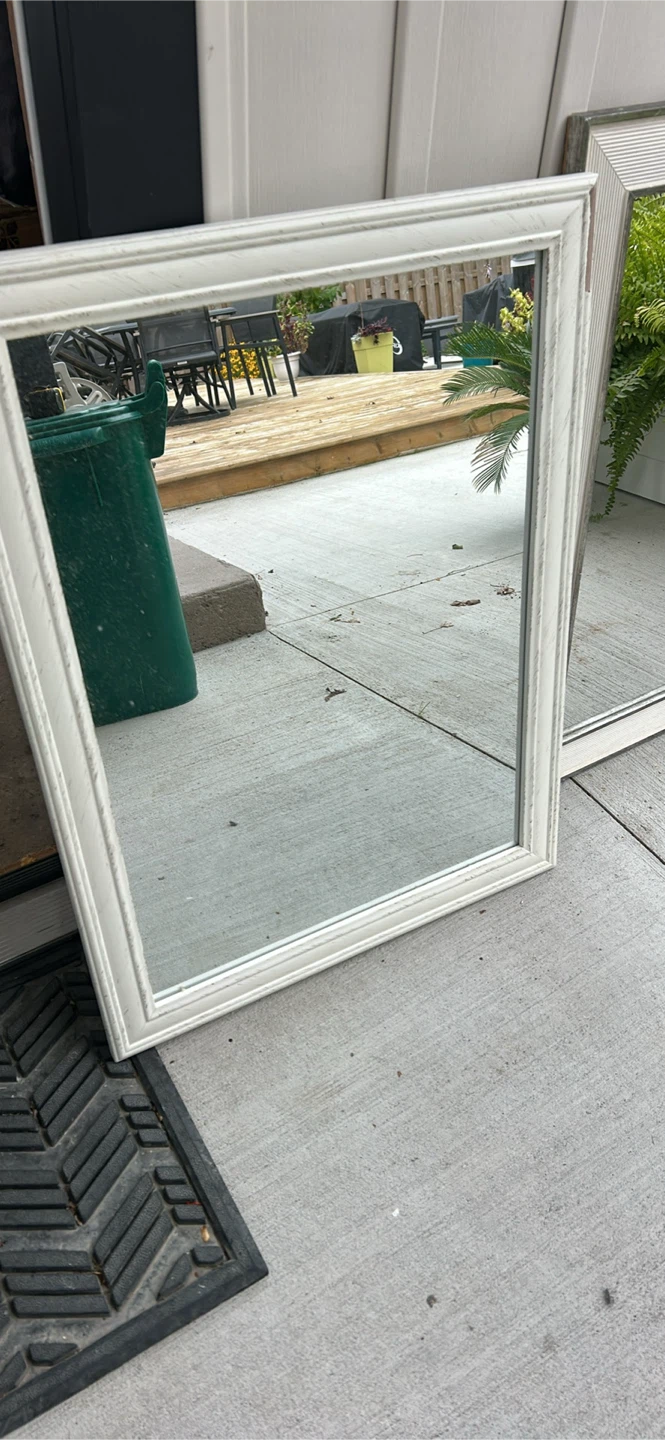 Mirror with a chip in frame