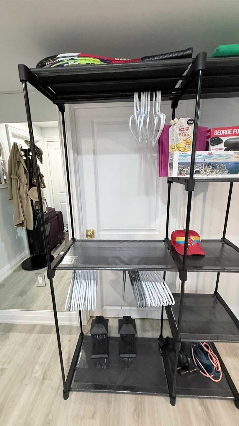 Black modular wire and fabric garment rack