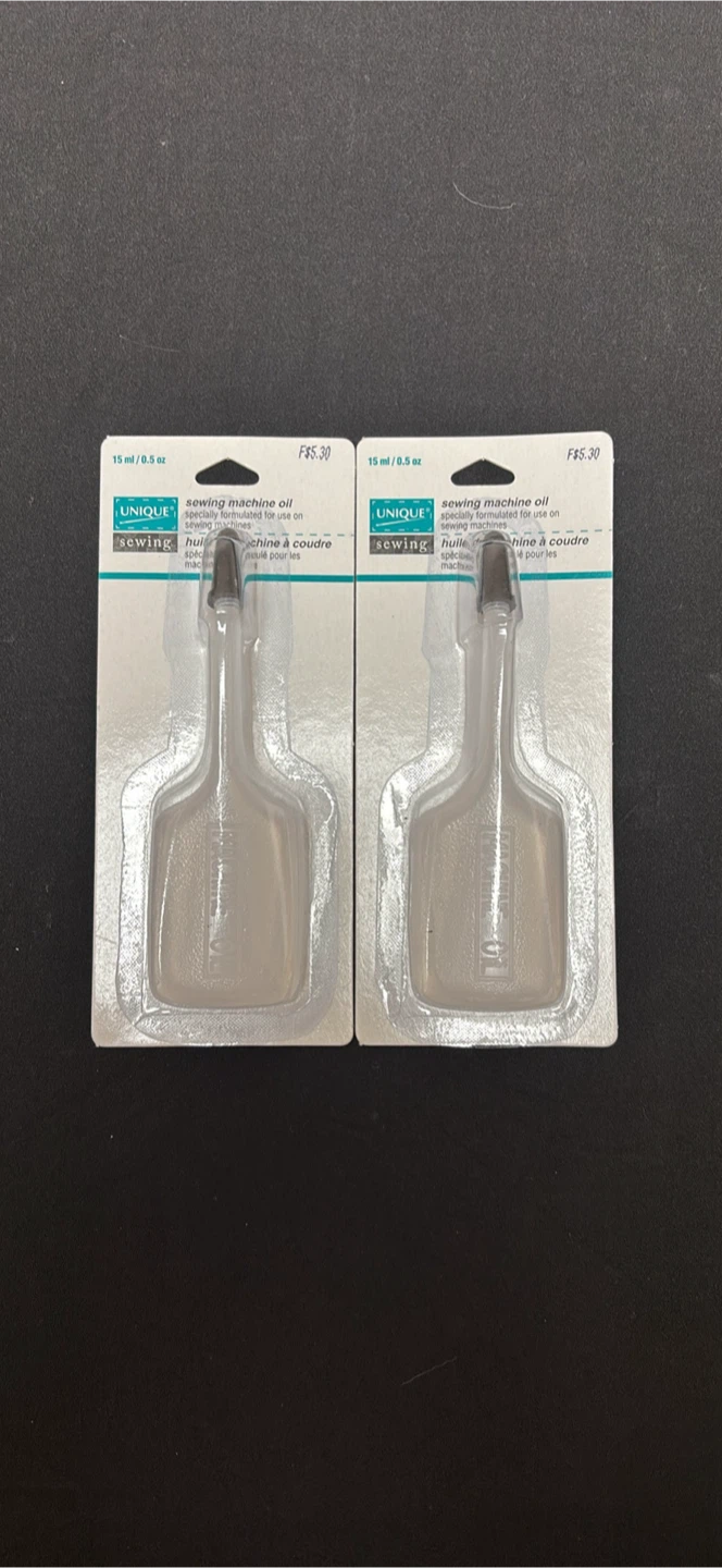 Two Unique Sewing Machine Oil Bottles