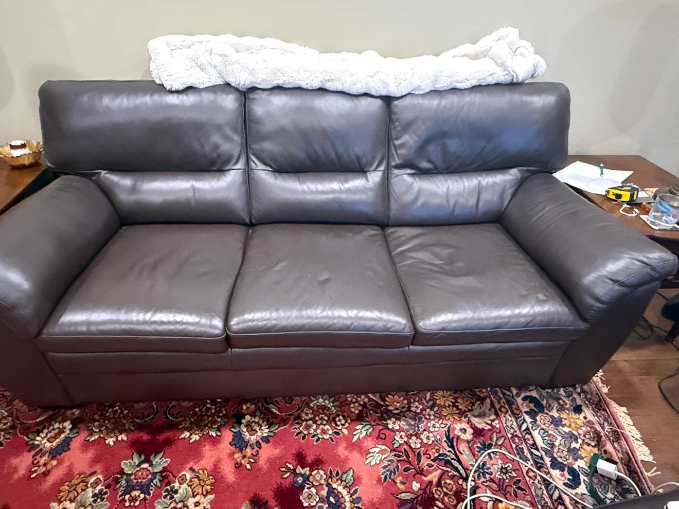 Dark brown leather sofa and matching armchair