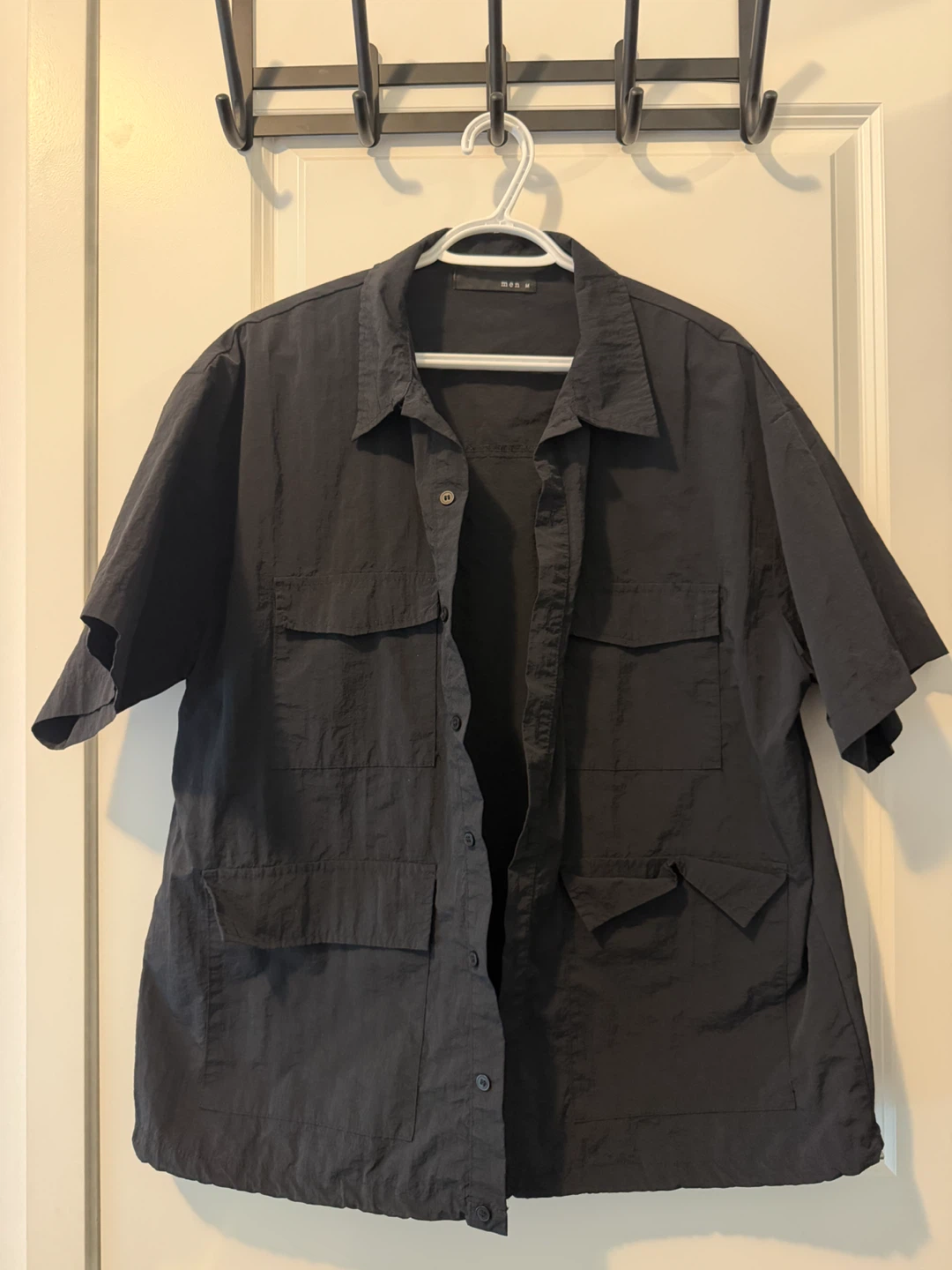 Black short-sleeve button-down shirt