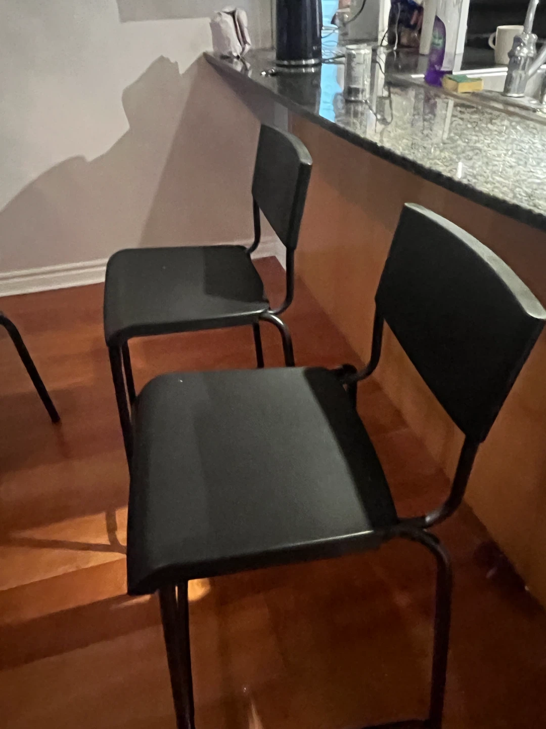 Two Black Metal Bar Stools