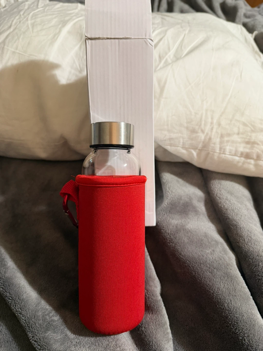 Brand new Glass Water Bottle with Red Sleeve