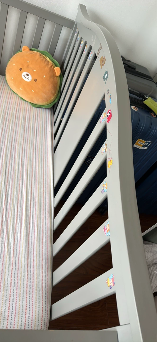 Grey wooden baby crib