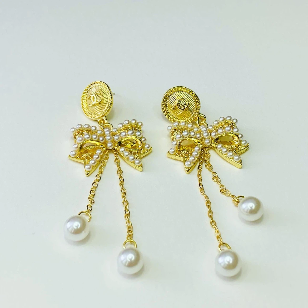 Gold Tone Bow and Pearl Drop Earrings