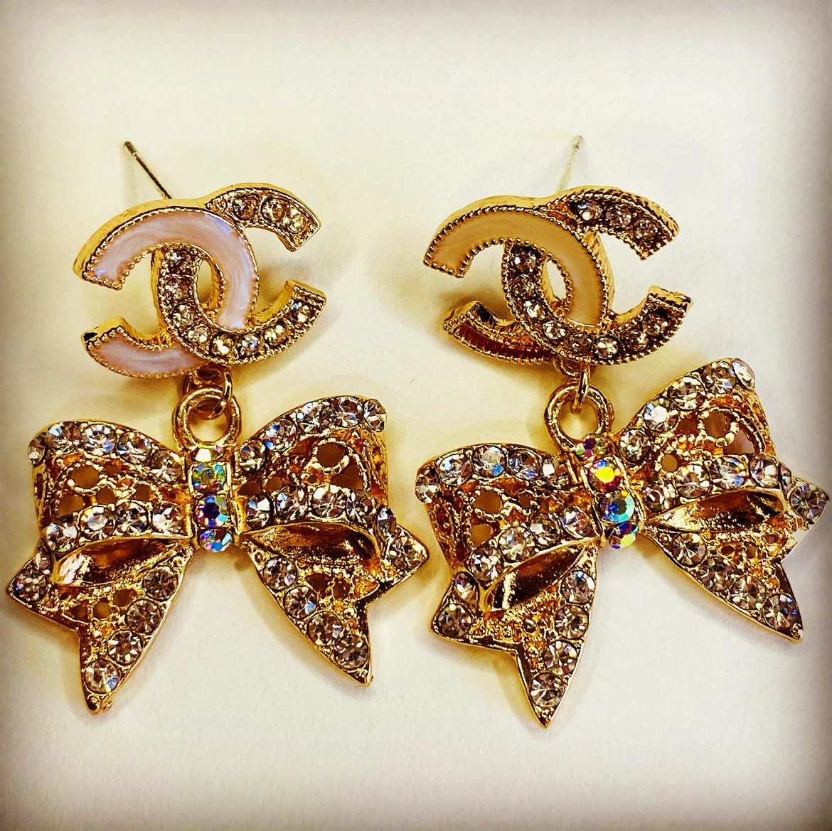 gold tone crystal bow earrings
