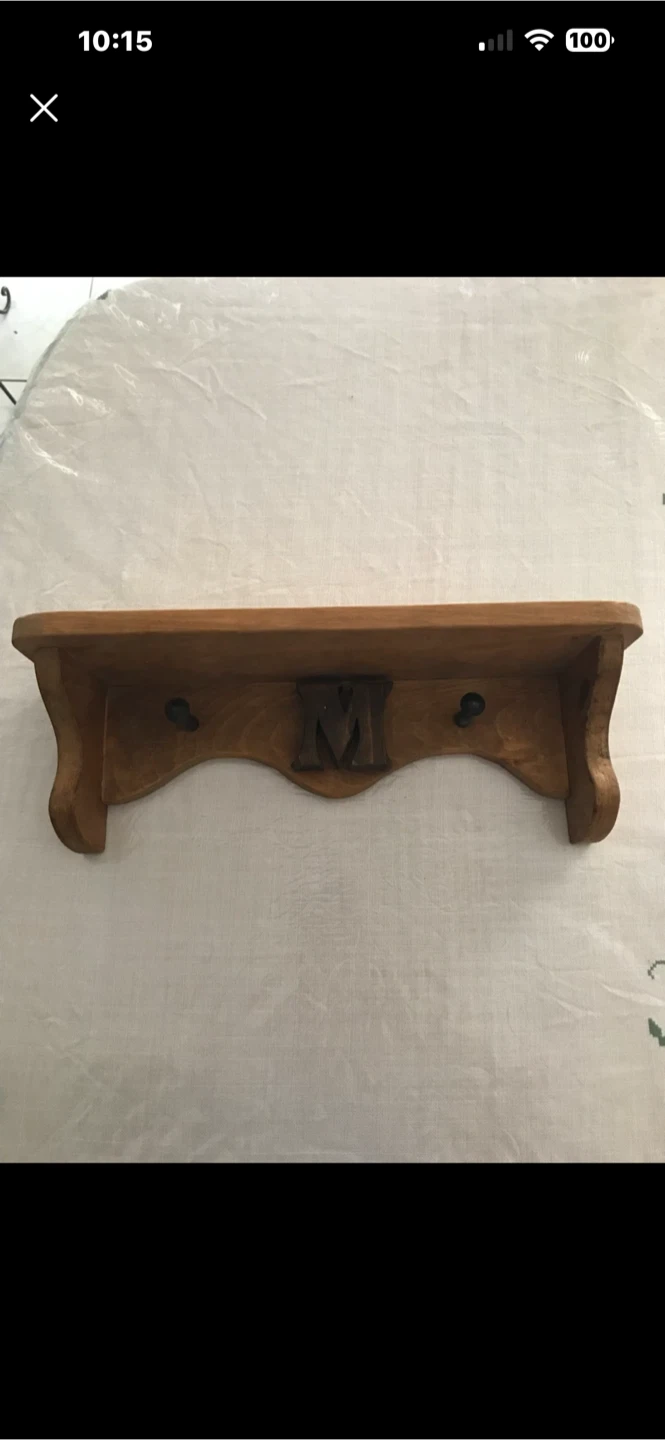 Wooden wall shelf with hooks