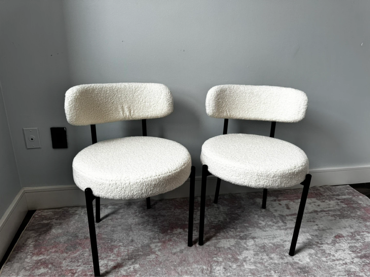 Two Cream Boucle Chairs with Black Metal Frames