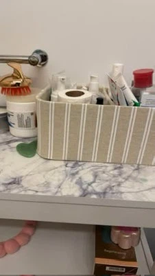 White bathroom cabinet with open shelf