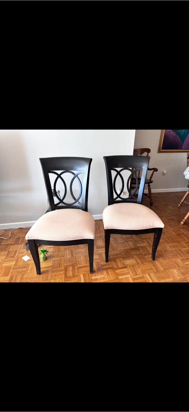 Two dark wood dining chairs