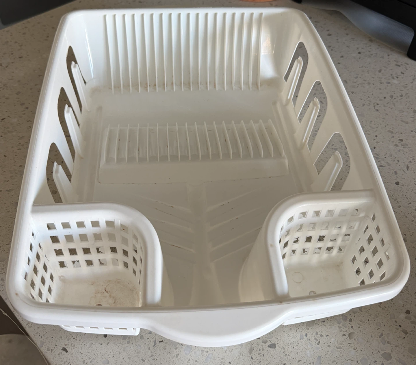 Dish drying rack and black plastic bin