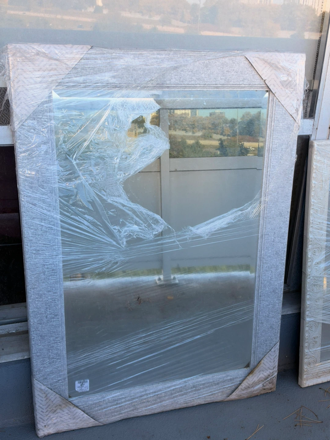 Large grey framed wall mirror