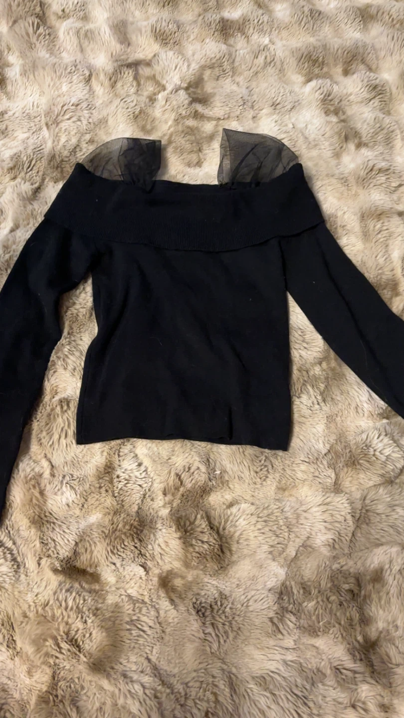 Black off-the-shoulder knit top