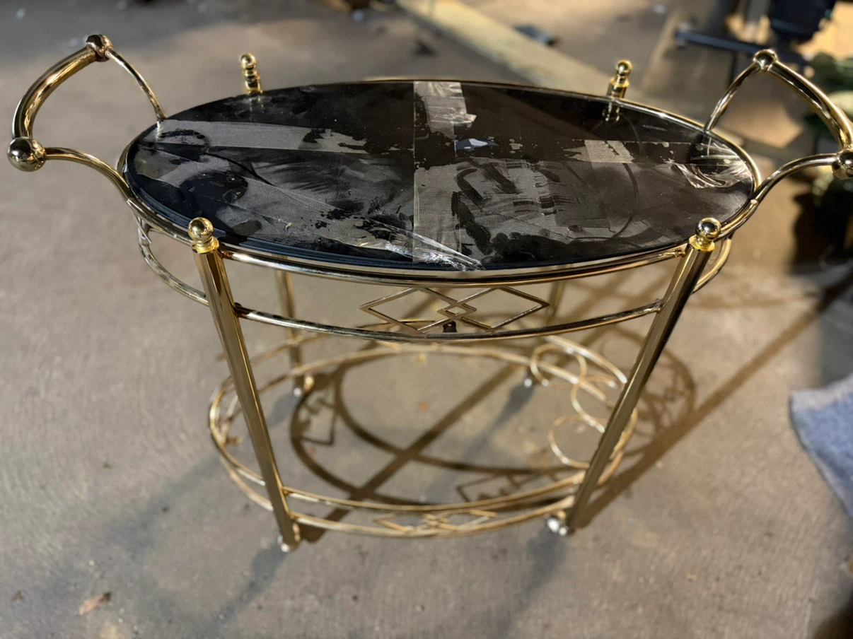 Oval Gold Tone Metal Serving Cart with Black Glass Top