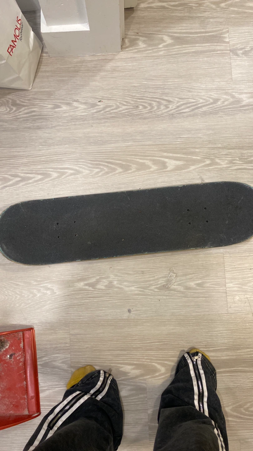 Skateboard with Playing Card Graphic